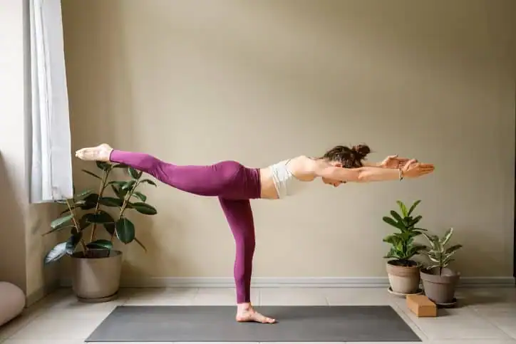 Woman doing Yoga exercise Oxford to help with toning the body. 